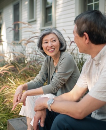 Two Clever Care members talking together outdoors